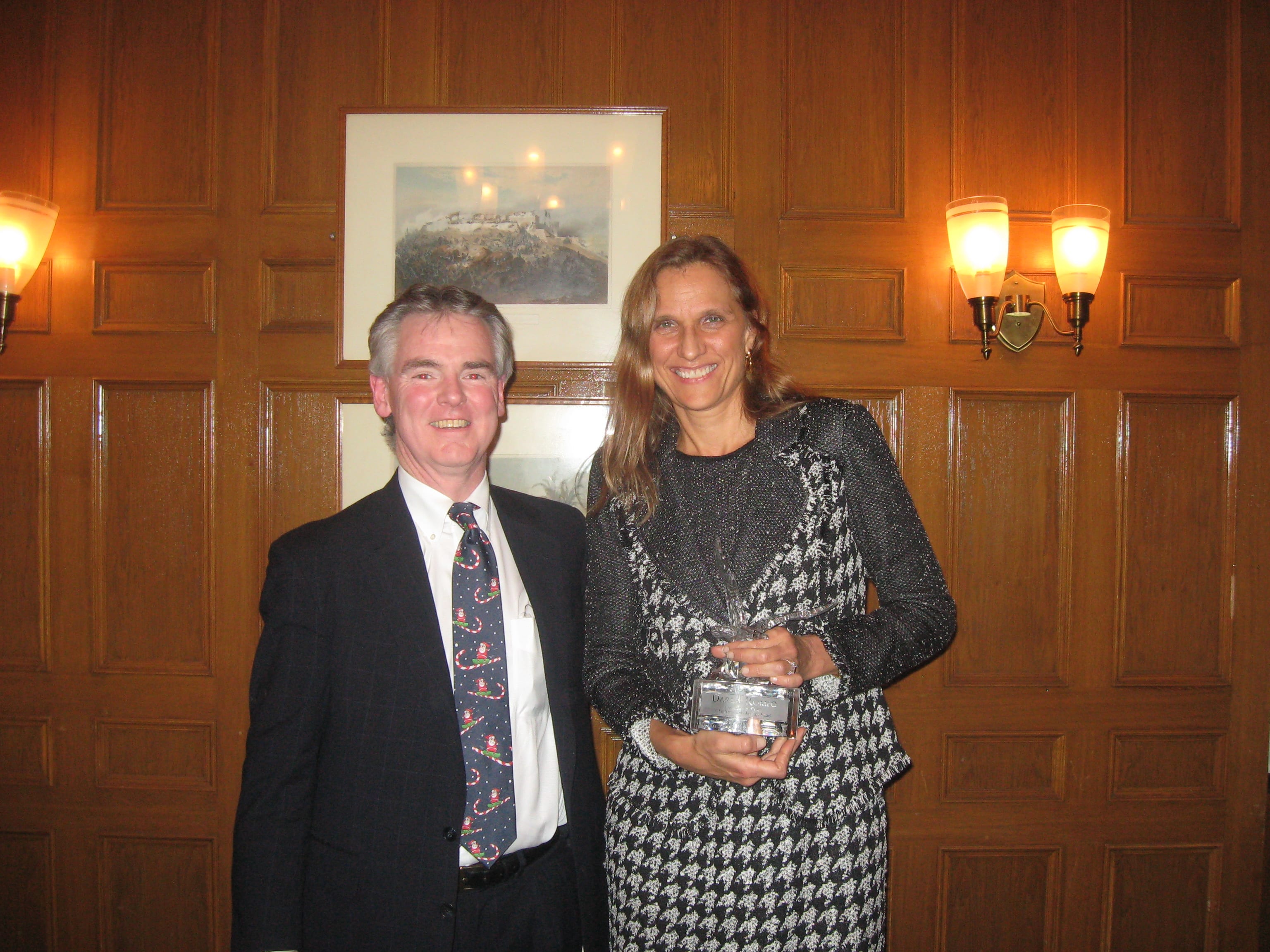 Timothy I. Duffy, Chairman of Tri-County Scholarship Fund, presents the Making a Difference Award to CSF President Darla Romfo.